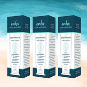 embi toothpaste 3 pack on a beach theme background 
